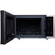 Black microwave oven with open door on a white background