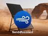 Solar panel on a stand with sand-resistant label in a desert landscape