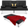 Black leather sofa bed with a red blanket and two drinks on a white background