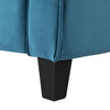 Close-up of a blue upholstered chair with a black leg on a white background