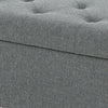 Gray upholstered storage ottoman with tufted design