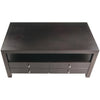 Dark brown wooden coffee table with four drawers on a white background