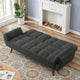 Dark gray sofa bed in a living room with a fireplace and rug.