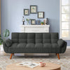 Gray sofa in a living room with a fireplace and decorative items.