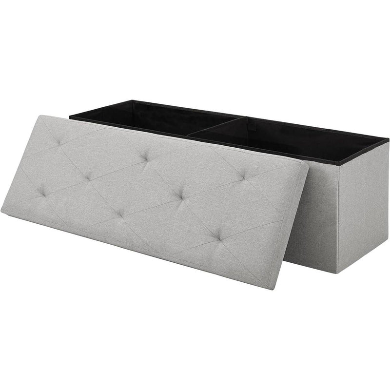 Gray tufted storage bench with a black top on a white background
