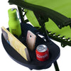 Camping chair with a tray holding a green water bottle, phone, and Coca-Cola can.
