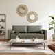 Modern living room with a gray sofa, wooden coffee table, and decorative mirrors on the wall.