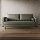 Green leather sofa in a room with wooden flooring and a textured wall.