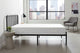 White mattress inside the bedroom of an apartment